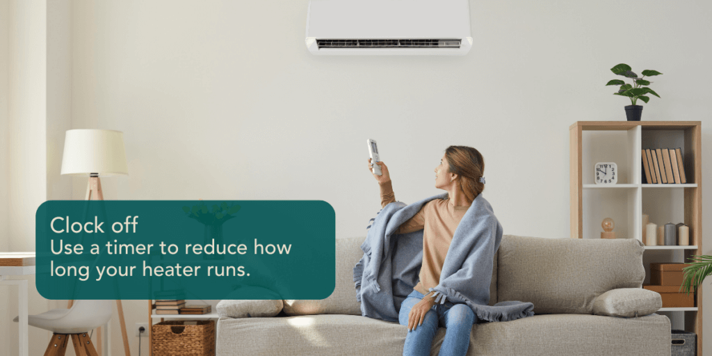 A woman pointing a remote at air conditioning unit. On-image text reads 'Clock off: Use a timer to reduce how long your heater runs.'